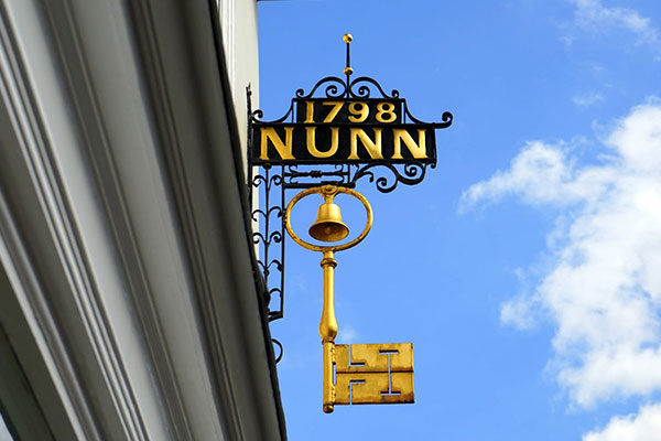 Custom Exterior Hanging Metal signage for 1798NUNN